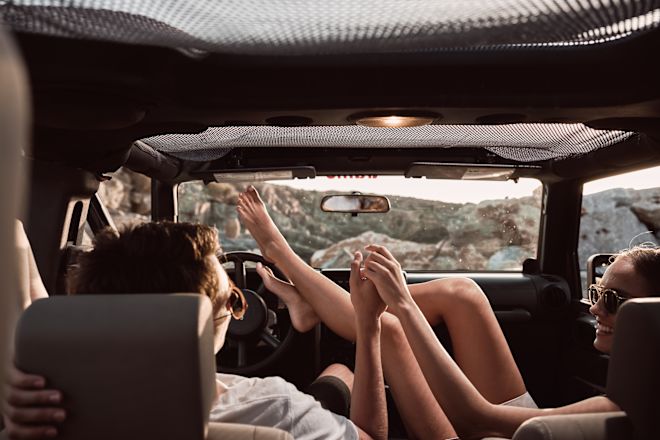 Couple Relaxing and Enjoying Each Others Company in a Car