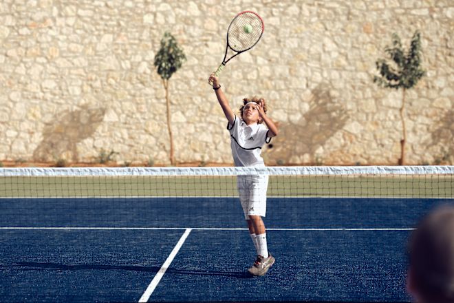 Kids Playing Tennis Outdoors