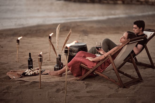 Couple Enjoying Private Dinner at a Beach