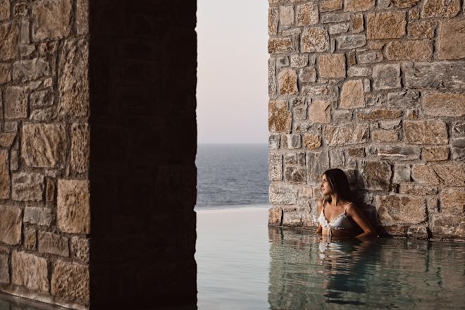 Woman standing in an indoor thalassotherapy pool at the spa