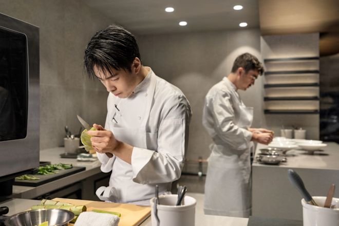 Chef Dae Kim and Chef De Cuisine Aaron Whittle, preparing entrees