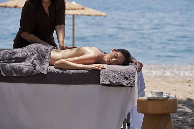 a Woman Getting a Massage at the Beach