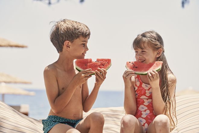 Kids Eating Watermelon at the Beach