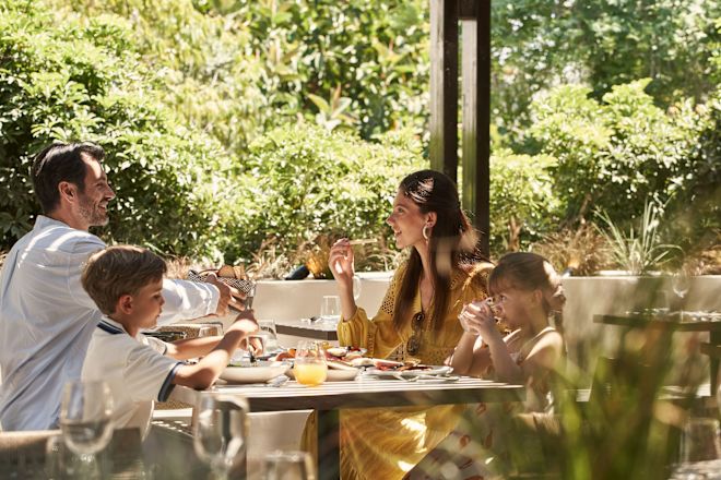 a Family Having Lunch in a Restaurants Terrace