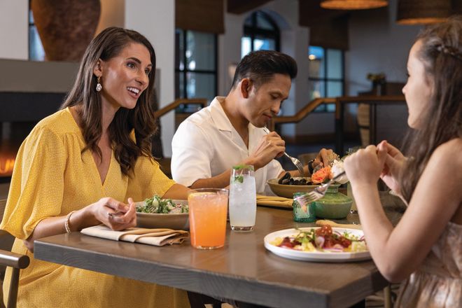 Friends Enjoying a Meal at Ox and Ocean Restaurant