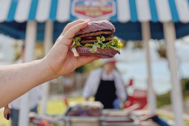 Person holding burger