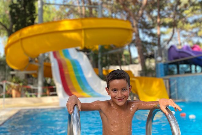 Boy coming out of water