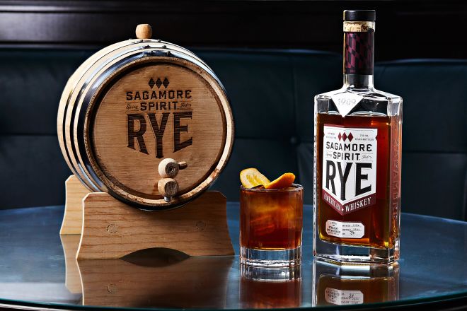 Sagamore Spirit Rye Whiskey in a small barrel next to a glass