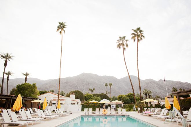 Outdoor pool with woman walking past