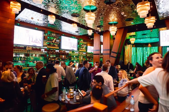 Interior of McGettigans bar with groups of people enjoying themselves