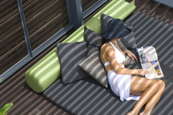 Woman on Poolside Bed