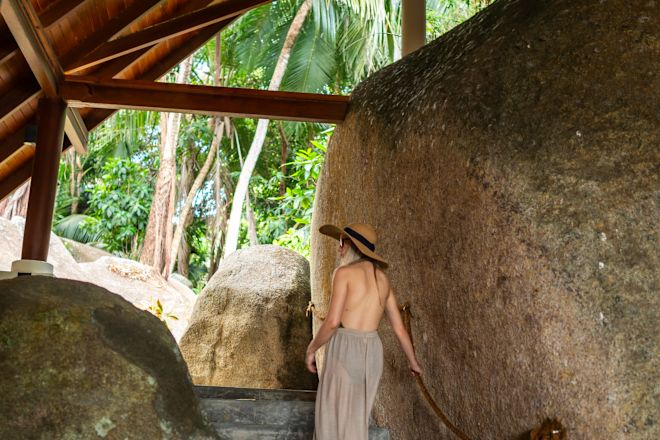 a Woman Walking on Stairs toward the Spa Reception Area