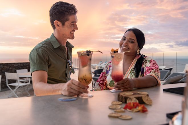 Sikunu Rooftop with man and woman enjoying cocktails