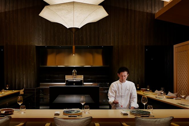 Restaurant with chef preparing food