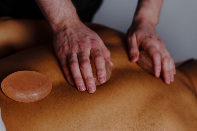 Person Getting a Salt Stone Massage at the Spa