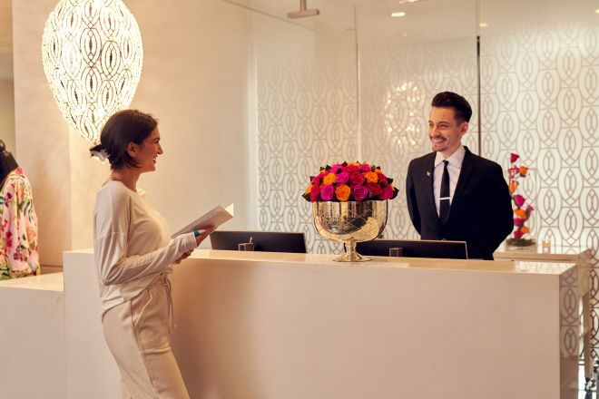 Woman Standing at the Retail Desk at the Spa