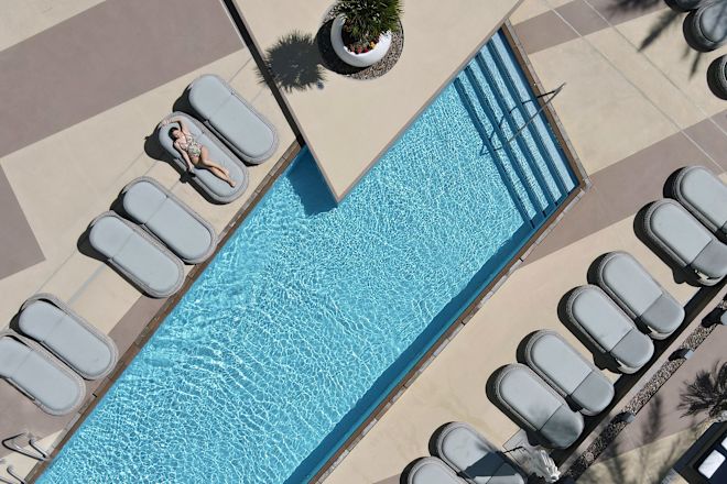 Woman Getting a Suntan at the Outdoor Pool