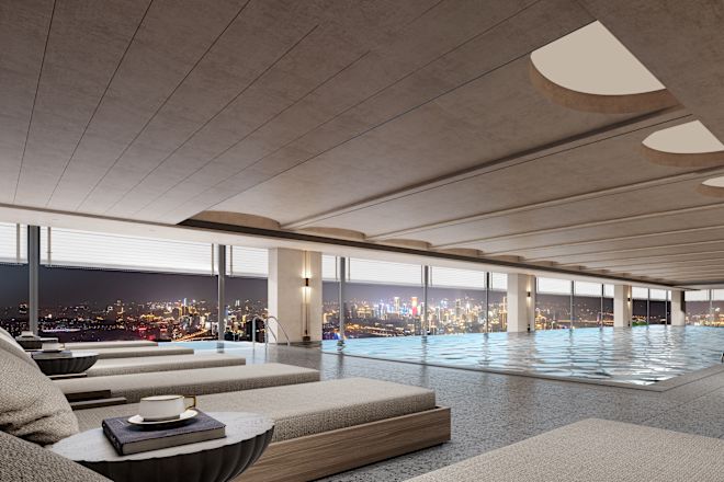 Indoor pool overlooking a city skyline