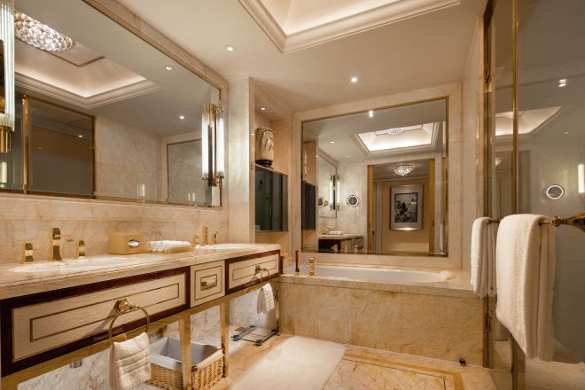 Bathroom area with mirror and bathtub