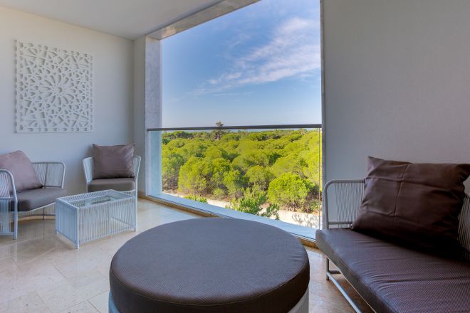 Deluxe Suite Living Area with View of Trees