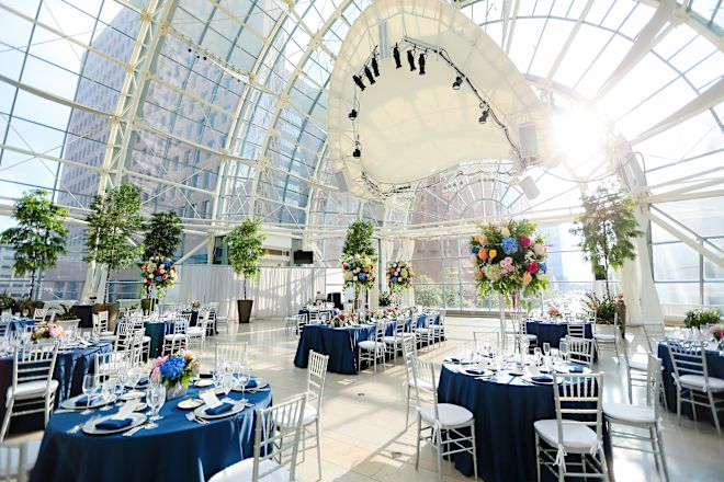 atrium wedding setup with round tables