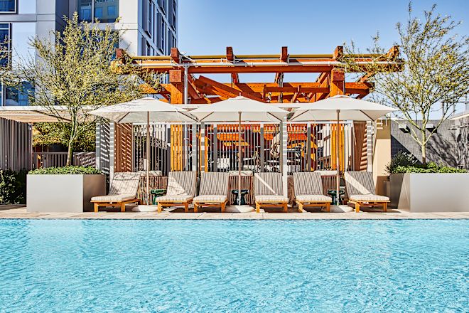 Outdoor pool with loungers