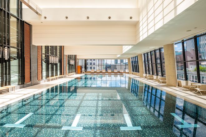 Indoor Pool with Large Windows and Siting Area