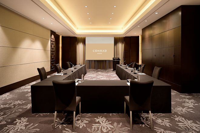 Socially distanced U-shaped meeting setup.