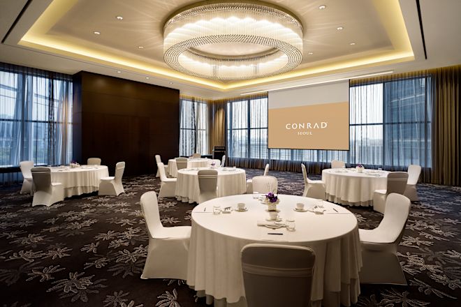 Socially distanced table set set ups, with white linens.