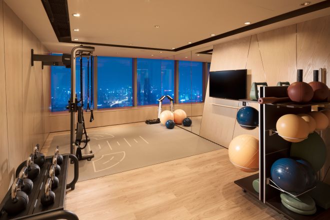 Fitness center with TV and kettlebells