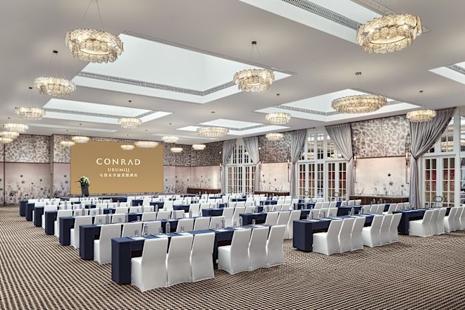 Classroom with tables, chairs and projector screen