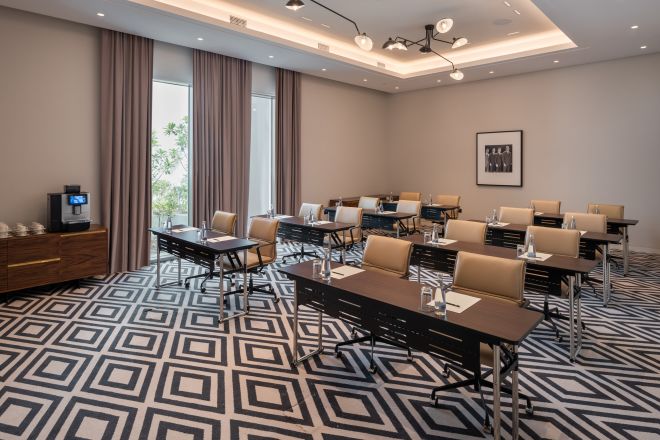 boardroom with rows of tables and chairs