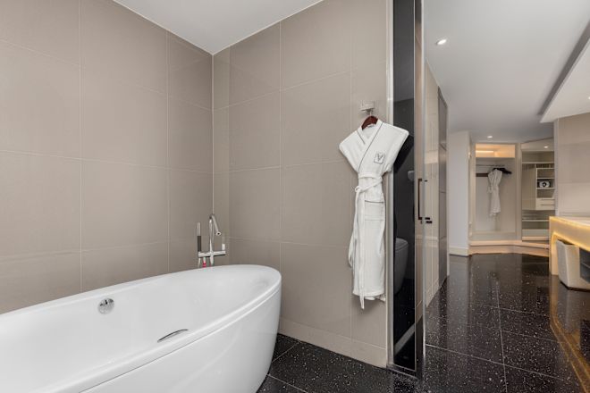 Suite Bathroom with  Amenities and Tub