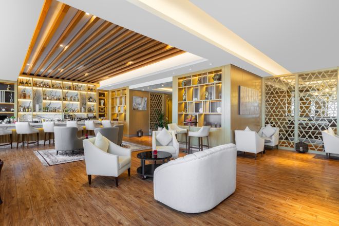 Lounge seating with bar in the background.