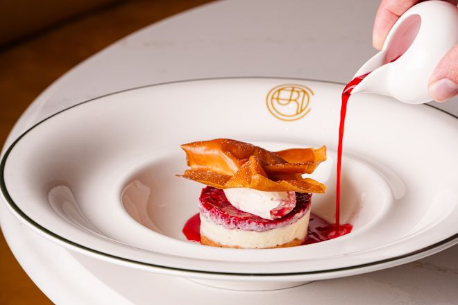 The Court restaurant, syrup being poured on a dessert plate