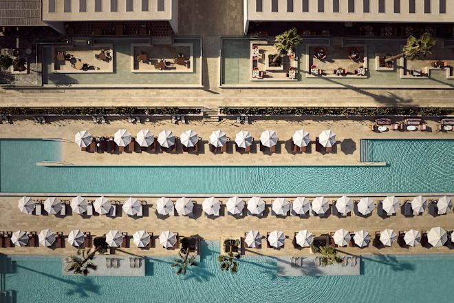 Outdoor Pool Area with Seats under Umbrellas