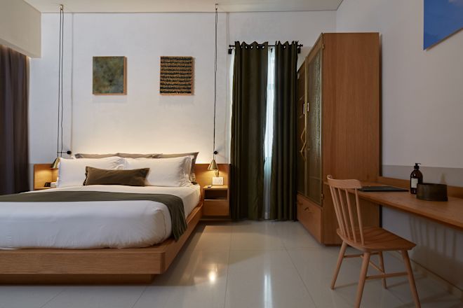 Accessible guestroom with bed and side table.