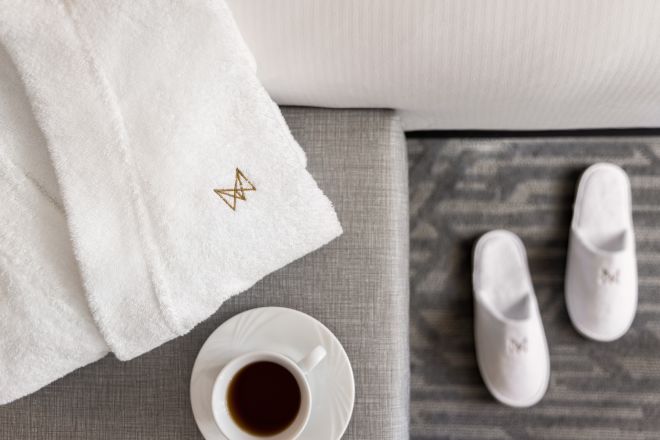 A cup of coffee and a pair of slippers.