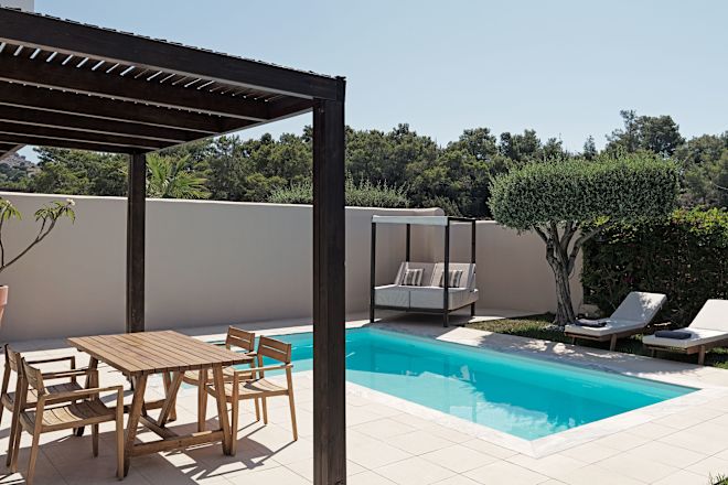 Private Pool and Terrace with a Table and Chairs in a Hotel Suite