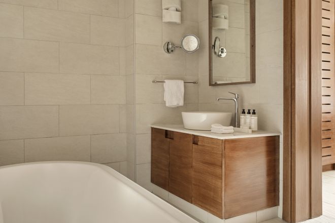 Vanity Area and Bathtub in a Guest Room