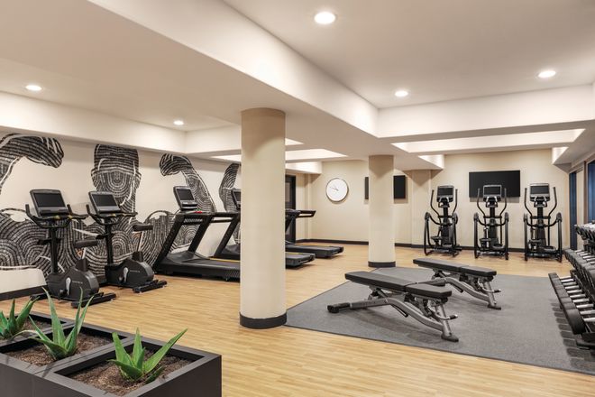 Treadmills and Weights in Fitness Center with HDTV
