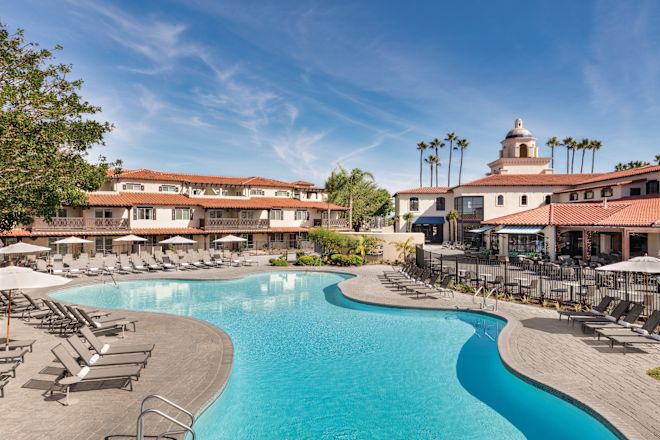 Outdoor Pool with Lounge Chairs under Umbrellas