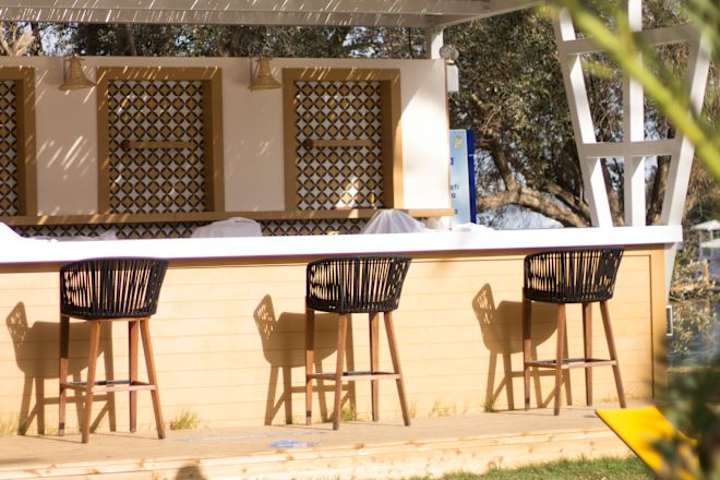 Outdoor bar area with stools