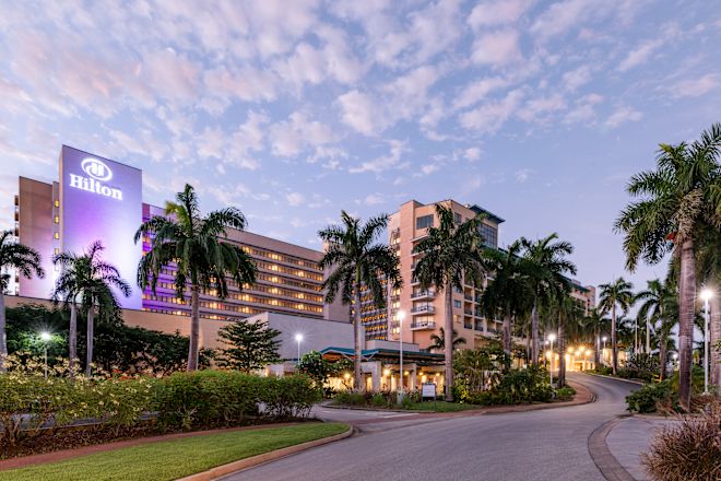 Hilton Hotel Exterior with Palm Trees
