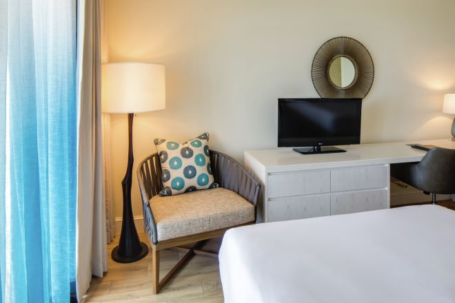 Guestroom with Double Beds, Lounge Area, Work Desk, and Room Technology