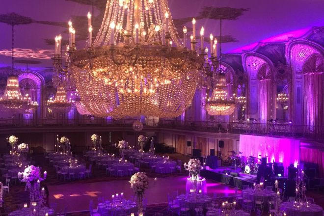 Ballroom with a large chandelier setup for a special event
