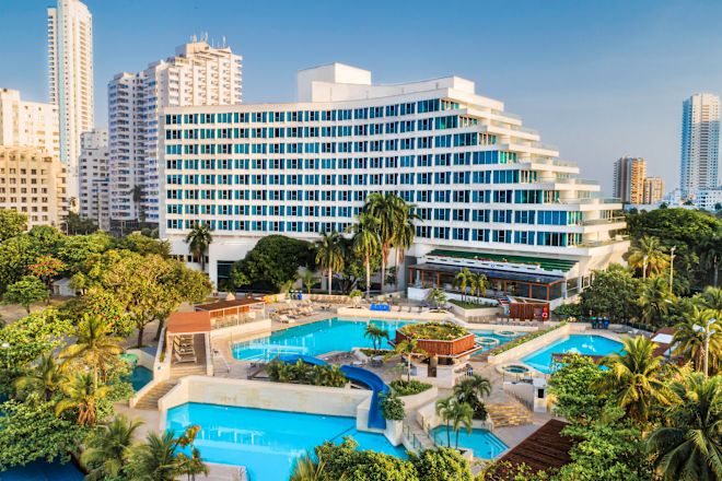 Hotel Exterior and Large Outdoor Pool Area