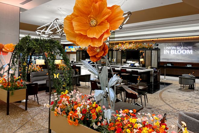 lobby bar decorated with orange and red flowers