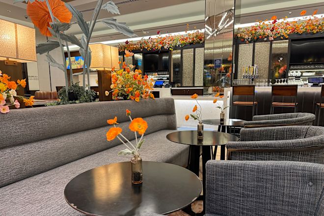 lobby bar decorated with orange and red flowers