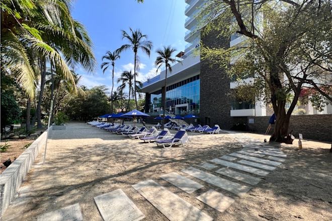 Patio Area with Lounge Chairs under Umbrellas